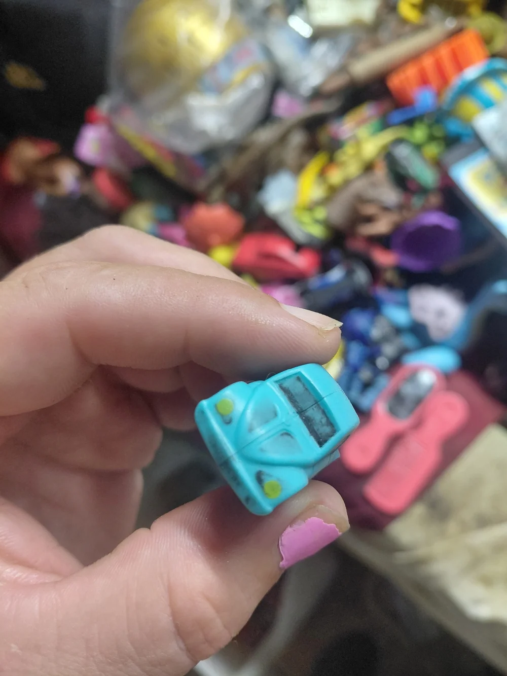 light-blue plastic toy Volkswagen Beetle (bug) car. [1] (https://boonsartshop.co